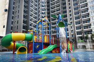 a water park with a colorful water slide at Atlantis Residences Malacca City by Nestcove in Malacca