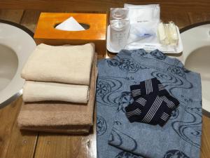 מיטה או מיטות בחדר ב-山荘 紗羅樹 Syaranoki