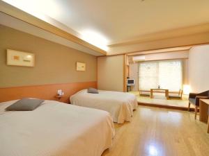 Vuode tai vuoteita majoituspaikassa Mashikokan Satoyama Resort Hotel