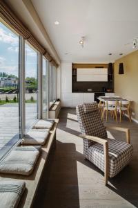 a living room with a couch and a table at Geras miegas in Druskininkai