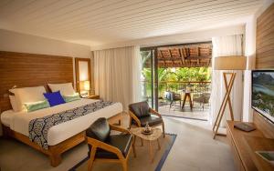Krevet ili kreveti u jedinici u okviru objekta Paradis Beachcomber Golf Resort & Spa