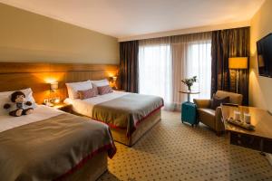 Voodi või voodid majutusasutuse Athlone Springs Hotel toas