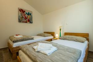 Postel nebo postele na pokoji v ubytování 2Bfree Apartments