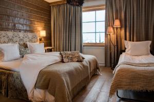 Postel nebo postele na pokoji v ubytování Hotel Bügelhof
