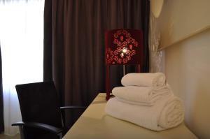 Letto o letti in una camera di Hotel Poseidon