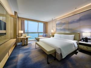 Postel nebo postele na pokoji v ubytování Primus Hotel Nanchang International Expo City