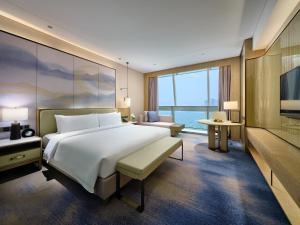 Postel nebo postele na pokoji v ubytování Primus Hotel Nanchang International Expo City