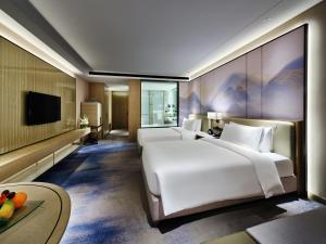 Postel nebo postele na pokoji v ubytování Primus Hotel Nanchang International Expo City