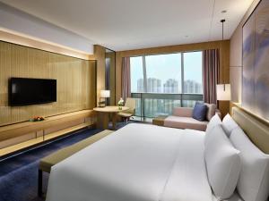 Postel nebo postele na pokoji v ubytování Primus Hotel Nanchang International Expo City