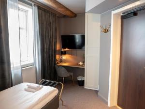 Postel nebo postele na pokoji v ubytování Hotell Gamla Staden