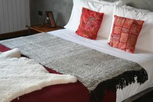 Ένα ή περισσότερα κρεβάτια σε δωμάτιο στο Hotel Altiplanico Puerto Natales