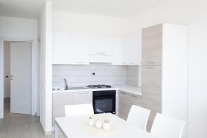 Kuchyňa alebo kuchynka v ubytovaní Airone Residence