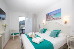 Postel nebo postele na pokoji v ubytování Hotel Marina