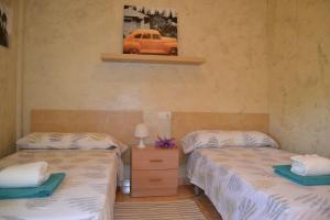 Posteľ alebo postele v izbe v ubytovaní Fabuloso apartamento familiar con piscina en Salou