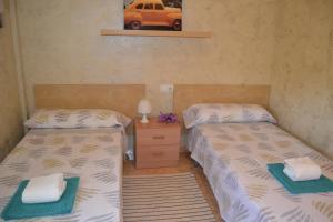 Posteľ alebo postele v izbe v ubytovaní Fabuloso apartamento familiar con piscina en Salou