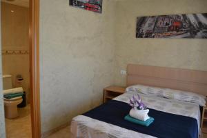 Posteľ alebo postele v izbe v ubytovaní Fabuloso apartamento familiar con piscina en Salou