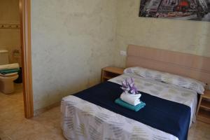 Posteľ alebo postele v izbe v ubytovaní Fabuloso apartamento familiar con piscina en Salou