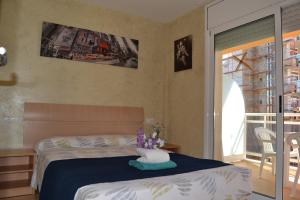 Posteľ alebo postele v izbe v ubytovaní Fabuloso apartamento familiar con piscina en Salou