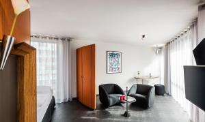 TV a/nebo společenská místnost v ubytování Penck Hotel Dresden