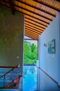 a house with a swimming pool with a view at Amuththa Resort in Anuradhapura