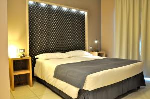 a bedroom with a large bed in a room at Letto & Riletto in Montecassiano +24 photos