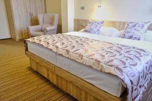 Hotel GTC 3* superior客房内的一张或多张床位