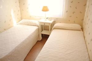 A bed or beds in a room at Beautiful seafront house