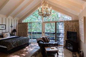 a bedroom with a bed and a large window at Belle Le Vie in Sassafras