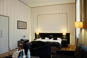 Säng eller sängar i ett rum på Konsumhotel Dorotheenhof Weimar