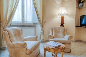 TV a/nebo společenská místnost v ubytování Armonia All'Opera