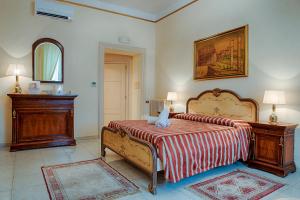 Postel nebo postele na pokoji v ubytování Armonia All'Opera