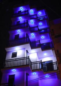 a building with blue lights on top of it at Opulence Colombo in Colombo