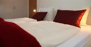 Postel nebo postele na pokoji v ubytování Hotel Weinblatt