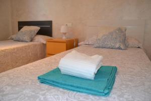 Postel nebo postele na pokoji v ubytování Salou apartamento cerca de playa y zona turística + 37 fotografií