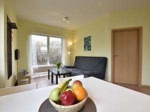 a bowl of fruit on a table in a living room at Peaceful Apartment in Zierow with Terrace in Zierow