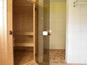 a shower with a glass door in a bathroom at Beautiful Holiday Home in Zierow near Sea in Zierow