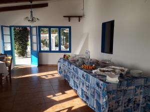 a table with food on it in a room at Hotel Grotte del Paradiso in Portoferraio