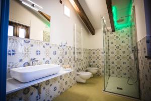 a bathroom with a sink and a shower at OASI FANTASIA in Agerola