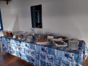 a blue and white table with food on it at Hotel Grotte del Paradiso in Portoferraio +22 photos