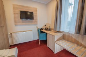 TV a/nebo společenská místnost v ubytování Hotel Texicana