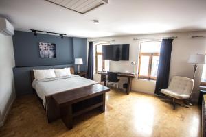 Postel nebo postele na pokoji v ubytování Hotel Belley