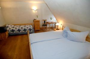 Postel nebo postele na pokoji v ubytování Hotel Aegidienhof