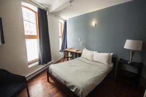 Postel nebo postele na pokoji v ubytování Hotel Belley