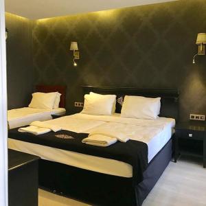 Voodi või voodid majutusasutuse Golden Gate Hotel Topkapı toas