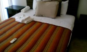 Ένα ή περισσότερα κρεβάτια σε δωμάτιο στο Vistazul Rentals