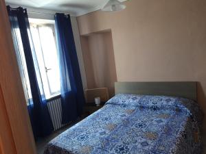 En eller flere senge i et værelse på Locanda della luna rossa
