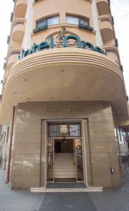 a hotel opera building with the entrance to it at Hotel Opera by Zeus International in Bucharest