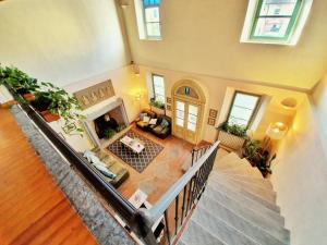 an overhead view of a living room with a fireplace at La Borasca - B&B in Casalpusterlengo