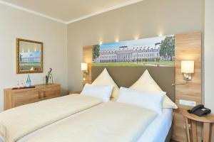Postel nebo postele na pokoji v ubytování Hotel Morjan