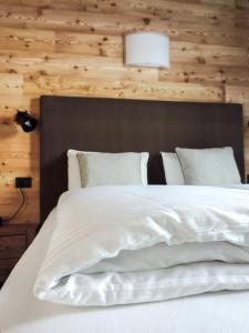 Postel nebo postele na pokoji v ubytování Tilio Chalet